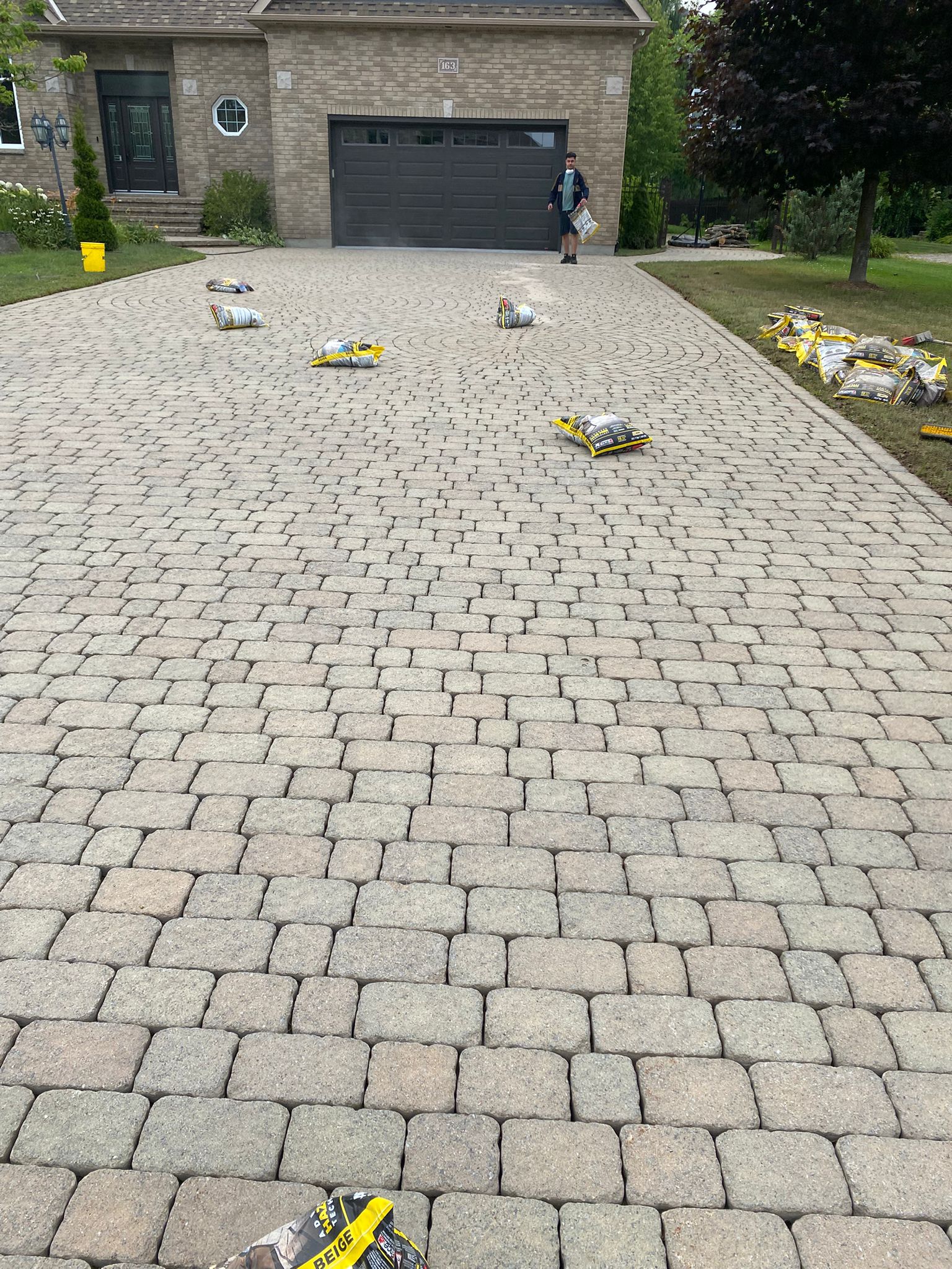 Sable polymère compactage pavé uni Ottawa